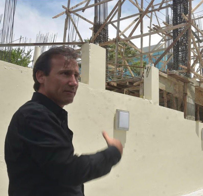 Nicolas Delrieu reviewing construction progress